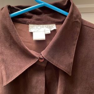 The blouse is a faux Type suede.